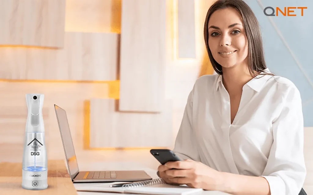 A young woman using MyHomePlus DSG by QNET India