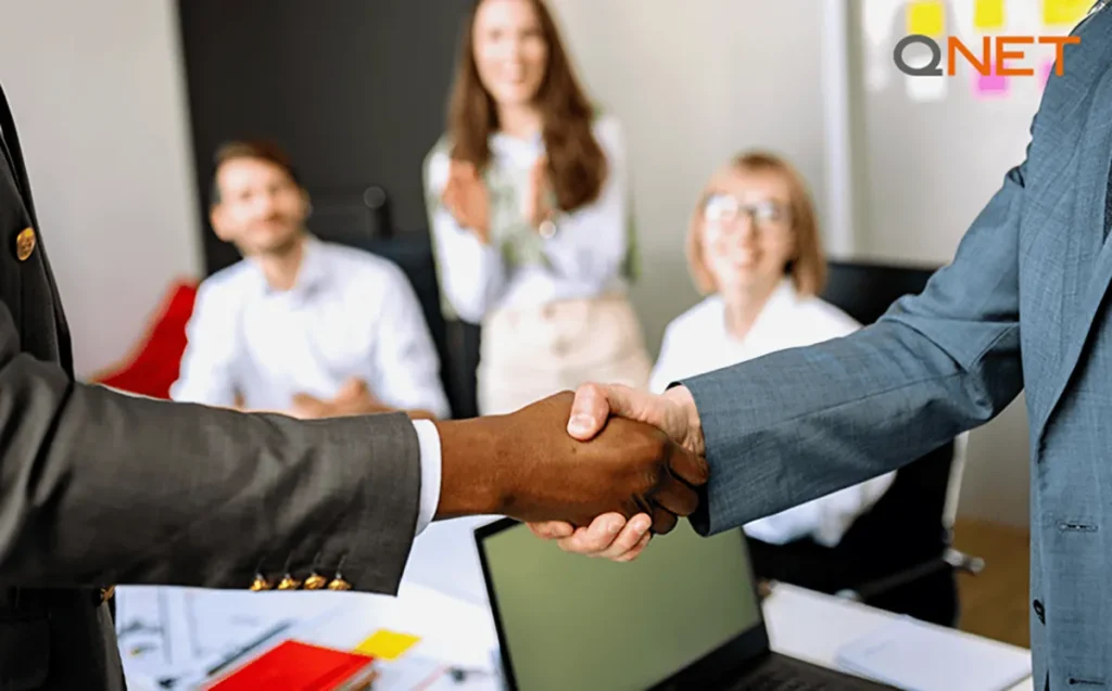 Shaking hands in a meeting