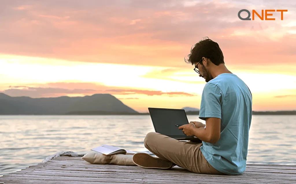 A man working by the lake 