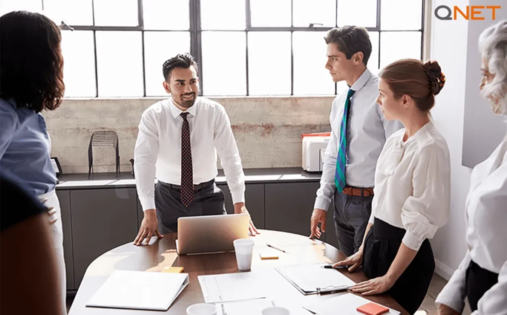 A new QNET entrepreneur smiling after presenting the QNET business plan