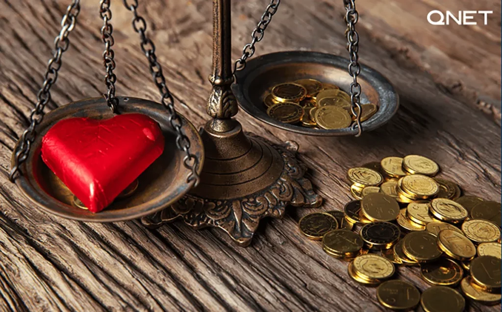 Depiction of work-life balance through a weighing balance with money on one side and heart on the other side