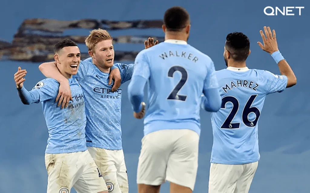 Manchester City players celebrating a goal