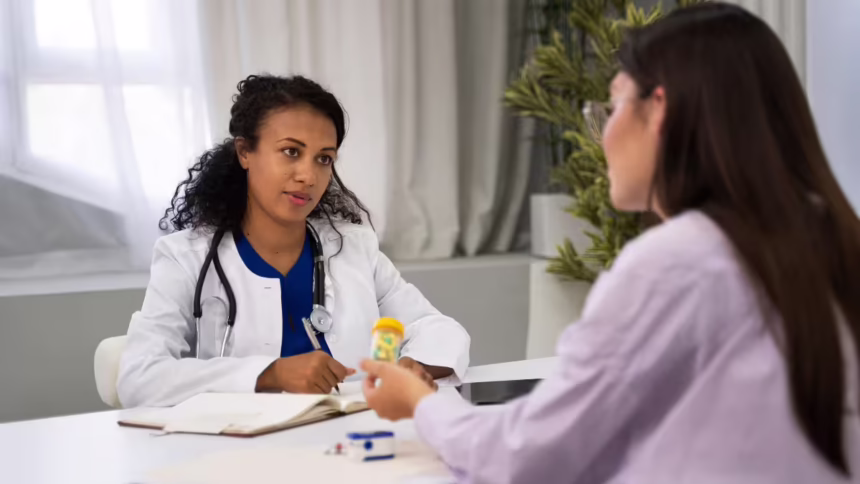 Doctor's Day 2026: Doctor consulting a patient and providing expert medical advice during a routine health check-up